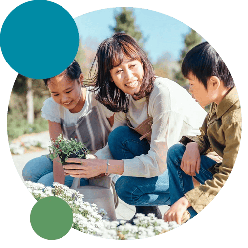 Family planting flower on garden Family planting flower on garden