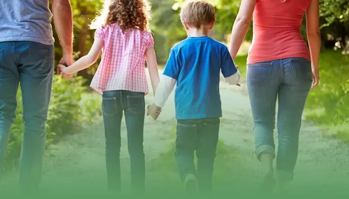 Family walking on trail
